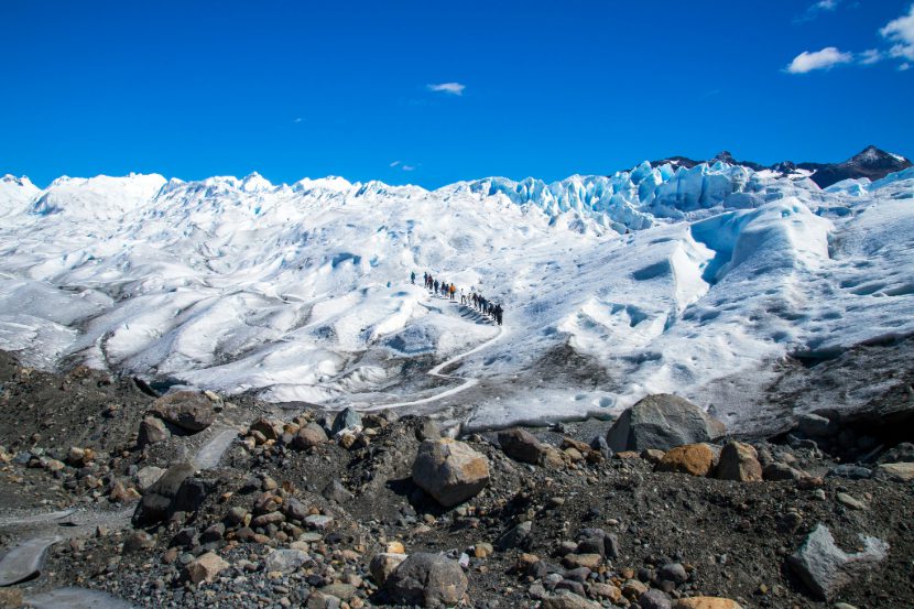 View of Perito Moreno glacier with hikers, one of the best things to do in Argentina