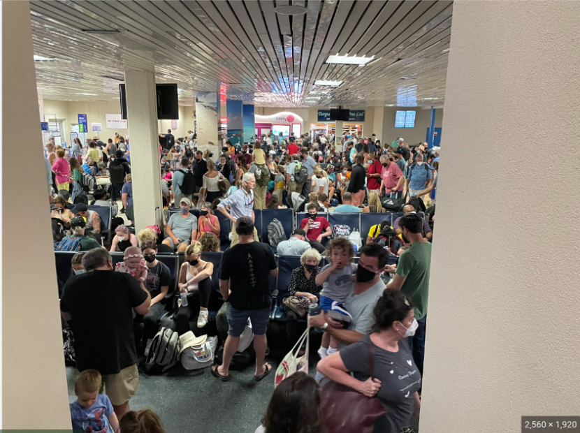 Providenciales airport terminal overcrowded with people